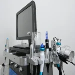 Esthetician using hydradermabrasion facial machine in a professional spa setting