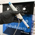 Hydradermabrasion facial machine with booster solution bottles for skin care treatment