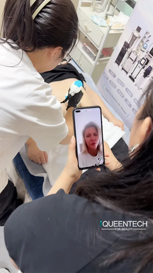 Professional trainer demonstrates standard operation of 40k cavitation handpiece equipped on Lymphatic Roller Machine for salon customer training