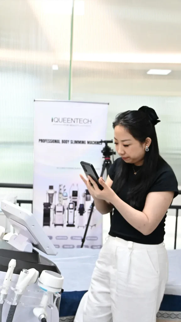 Sales specialist demonstrating operation guide of Lymphatic Roller Machine to customer, professional lymphatic drainage beauty equipment onsite training