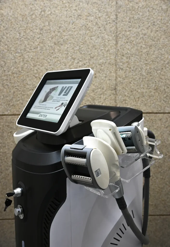 Front detailed view of Lymphatic Roller Machine fitted with vacuum roller treatment handpiece for salon lymph drainage and body contouring
