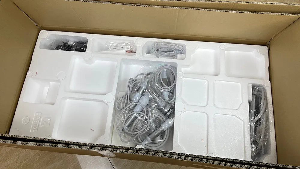 Custom molded foam liner inside carton for hydradermabrasion machine, separate cavities for main unit, handpieces and cables for shockproof export packaging