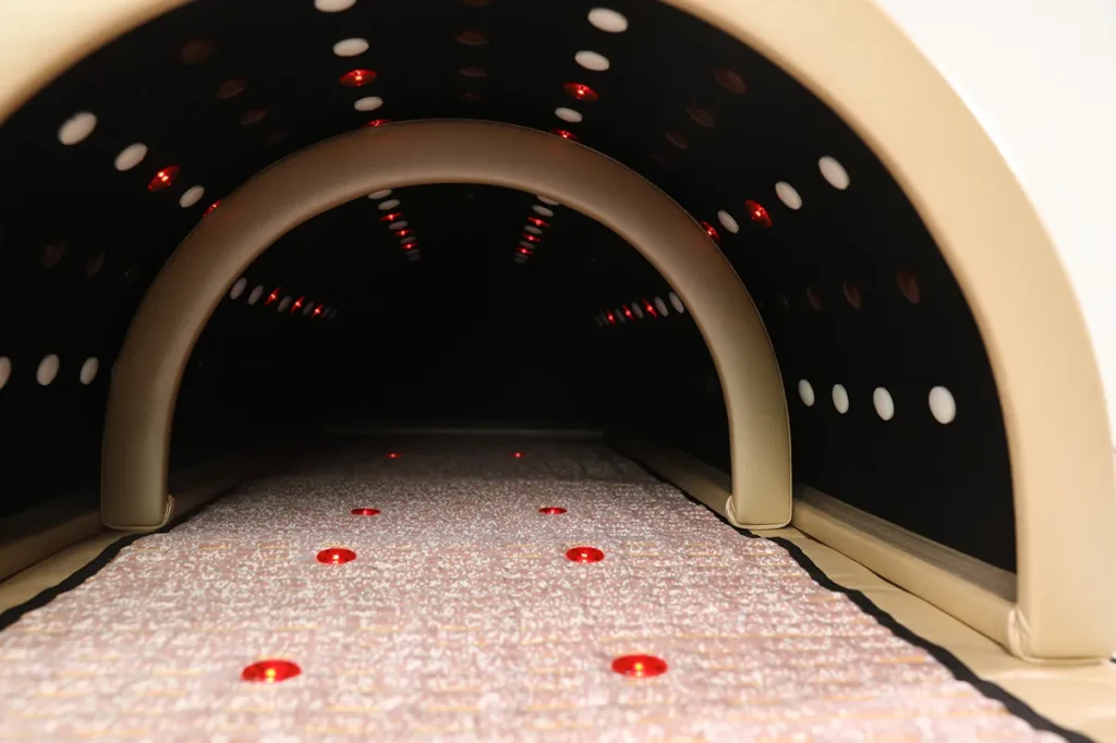 Interior view of far infrared sauna dome with built-in heating mats and infrared light panels for home detox sweat therapy