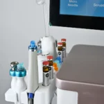 15 in 1 Hydrodermabrasion Facial Machine close-up, serum bottle and booster handpiece for hydrafacial nutrient infusion treatment