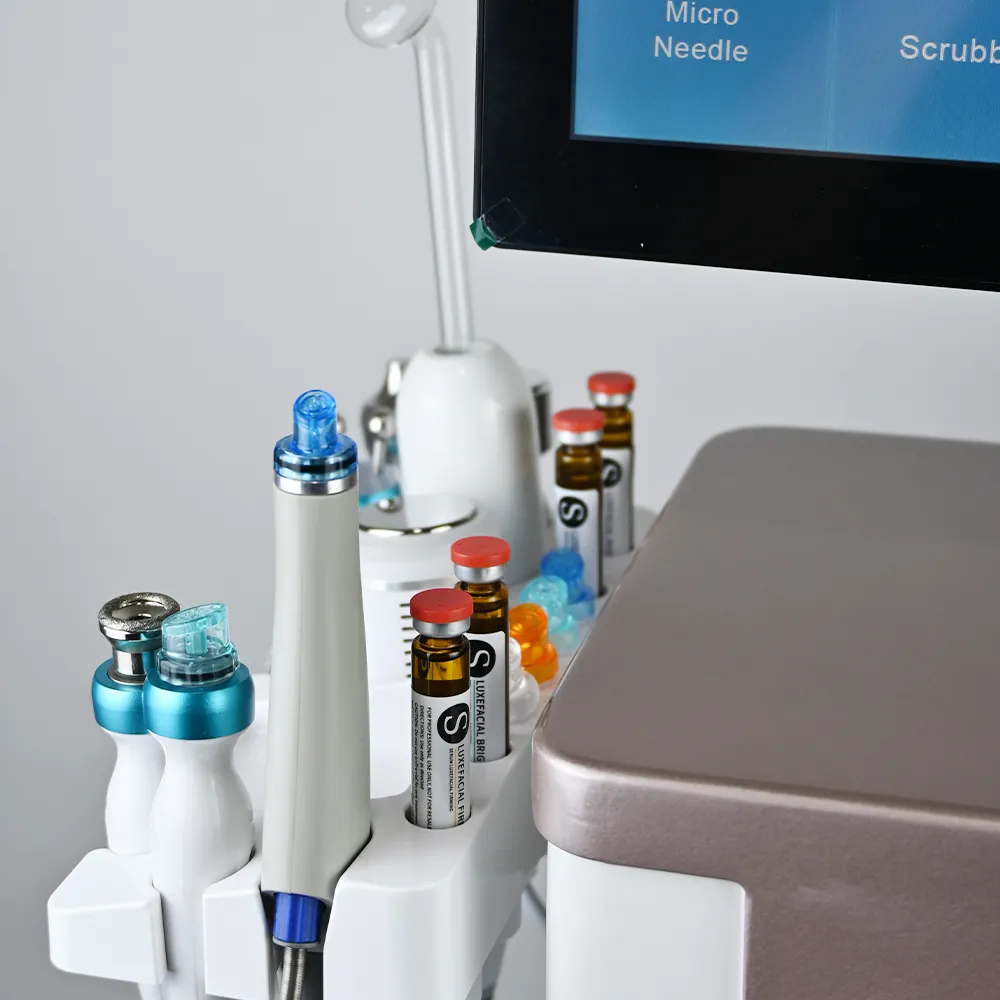 15 in 1 Hydrodermabrasion Facial Machine close-up, serum bottle and booster handpiece for hydrafacial nutrient infusion treatment