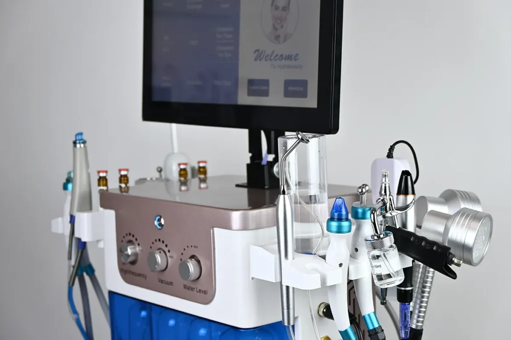 15 in 1 Hydrodermabrasion Facial Machine, right side view showing multiple treatment handpieces for professional salon facial skincare